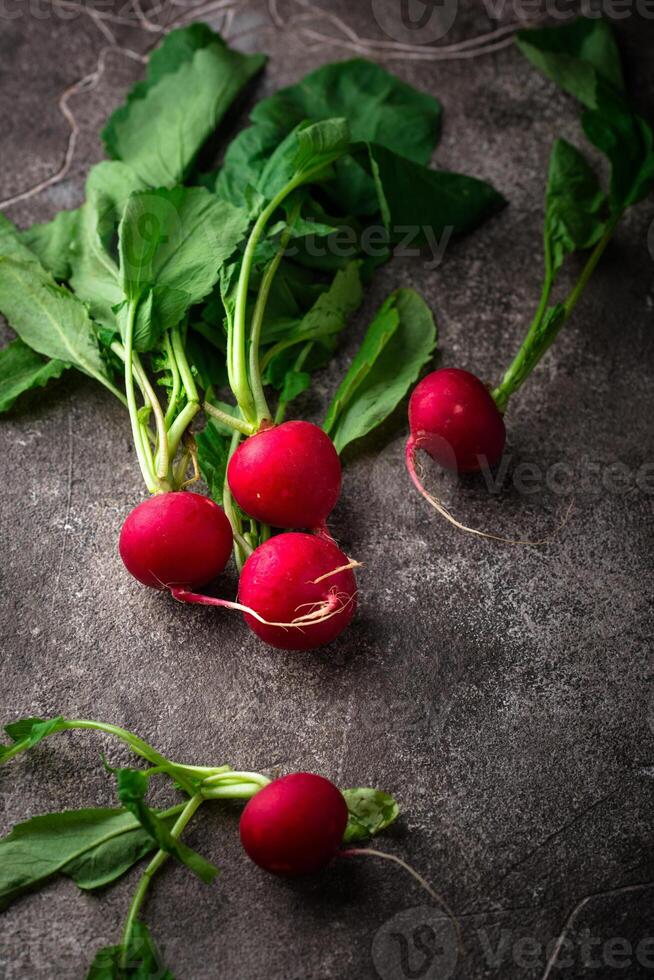 Fresh organic radish on green background photo