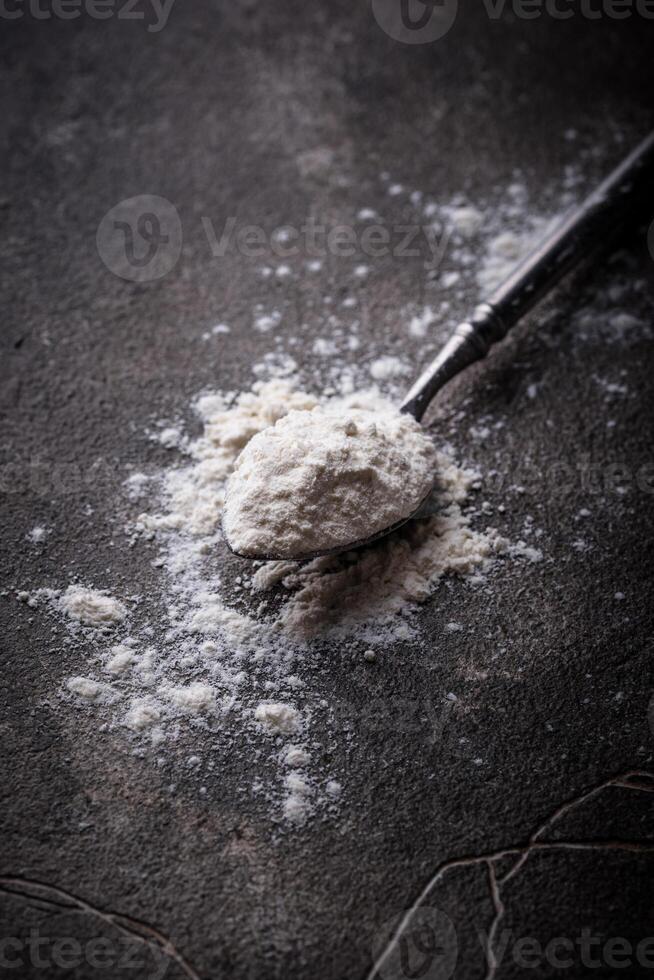 Wheat flour on dark. Baking background photo