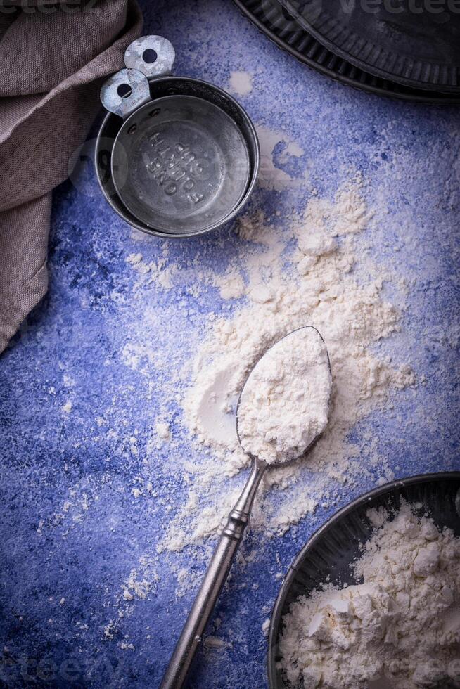 Wheat flour on dark. Baking background photo