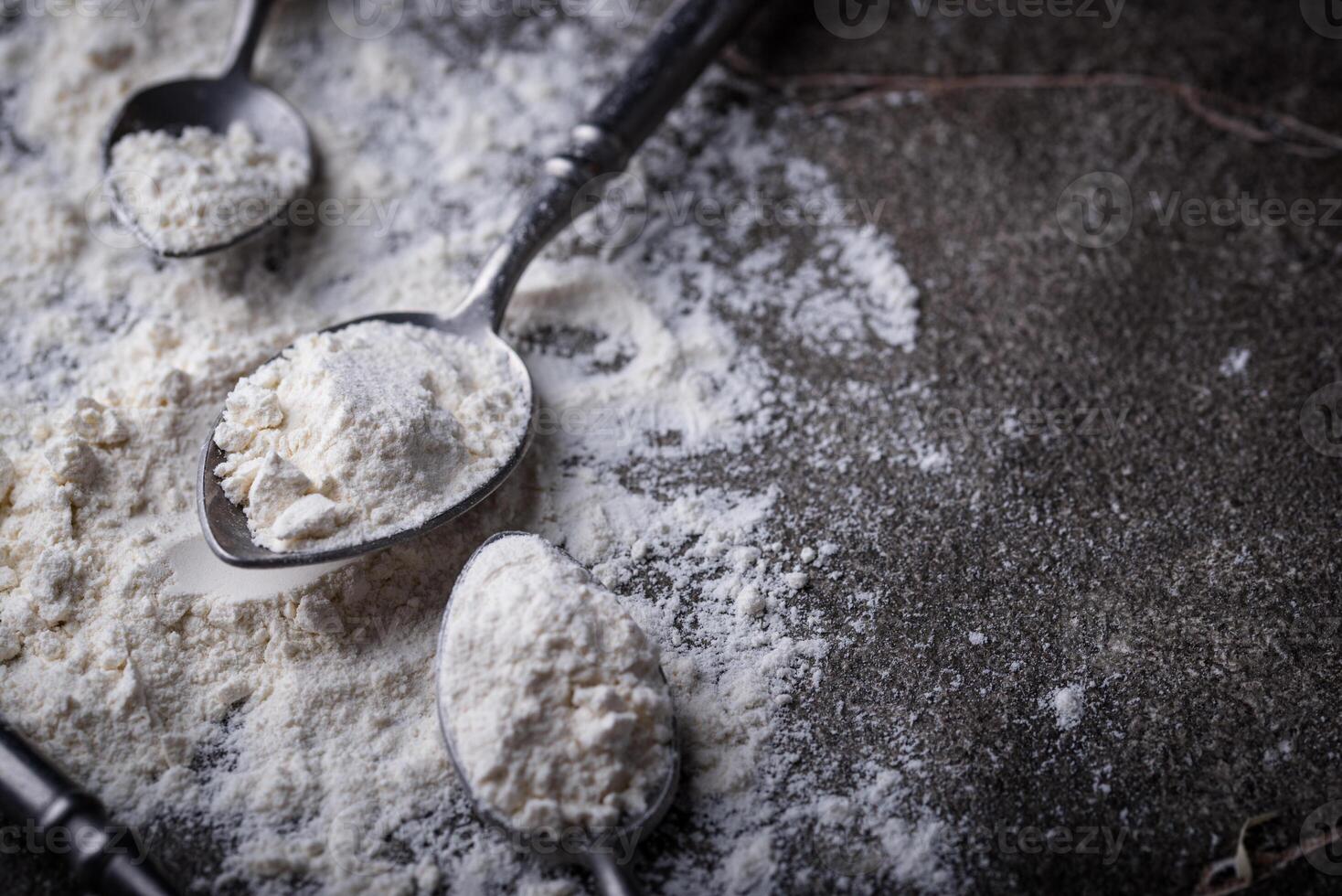 Wheat flour on dark. Baking background photo