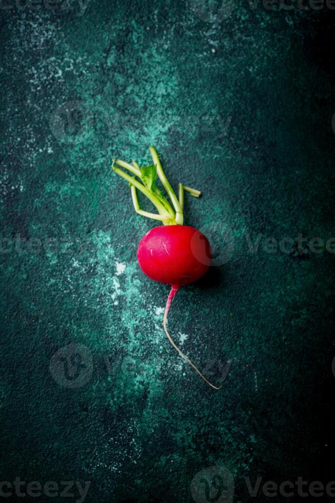 Fresh organic radish on green background photo
