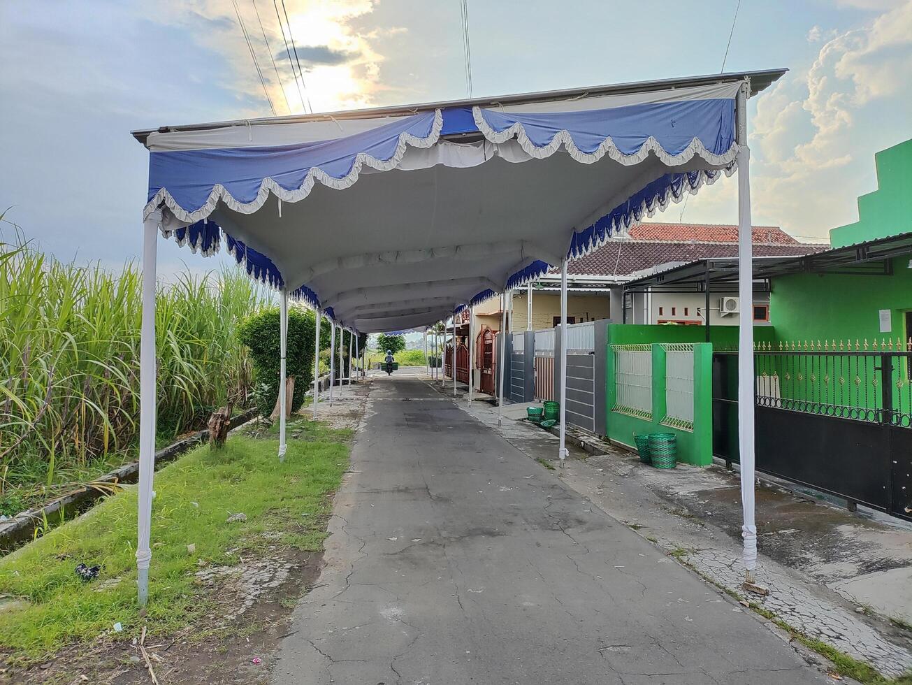 A wedding tent is set up on the road in a village in Karanganyar, Indonesia photo