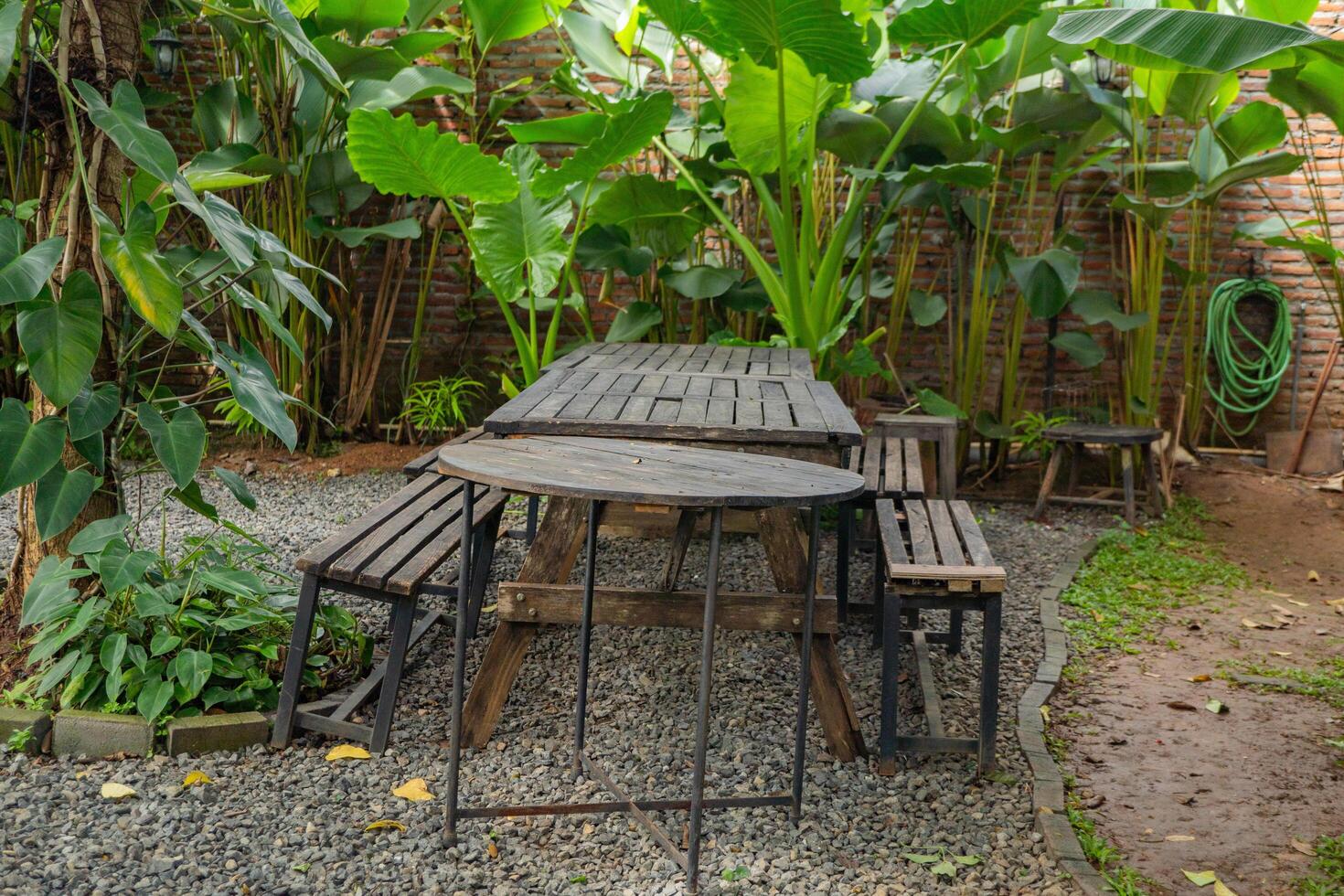 Empty chair and table on the garden cafe. The photo is suitable to use travel destination, holiday and vacation content media.