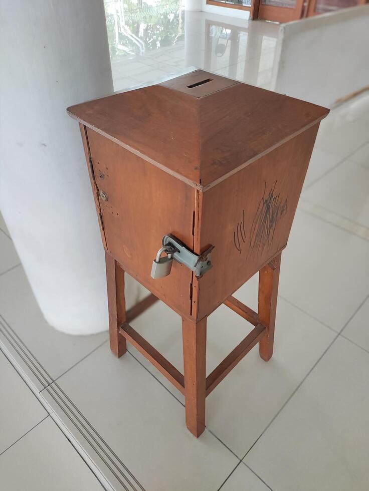 a charity box at a mosque in Surakarta, Indonesia photo