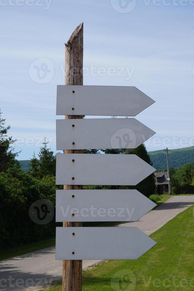 Wooden Signpost with Many Arrows photo