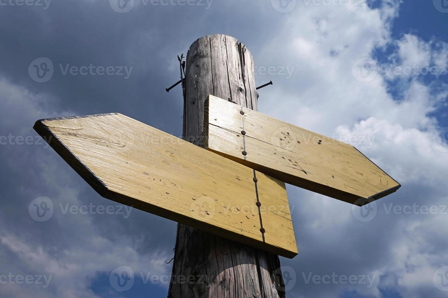 Wooden Signpost with Two Arrows photo