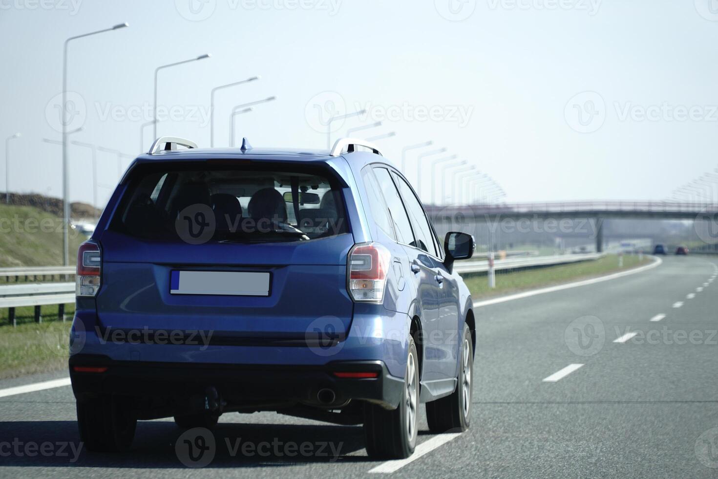 Car Drives on a Highway photo
