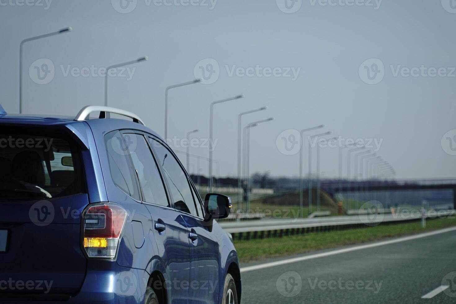 Car Drives on a Highway photo