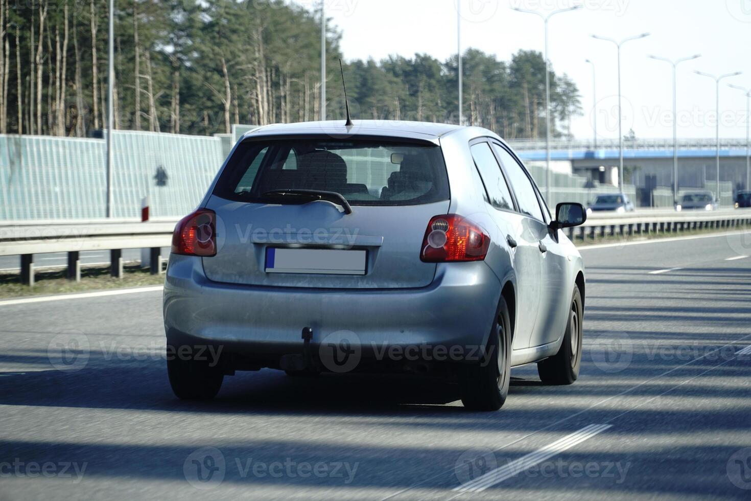 Car Drives on a Highway photo