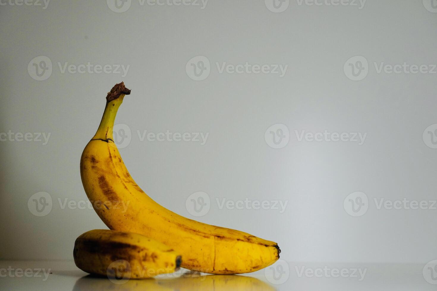 yellow bananas on a white background photo
