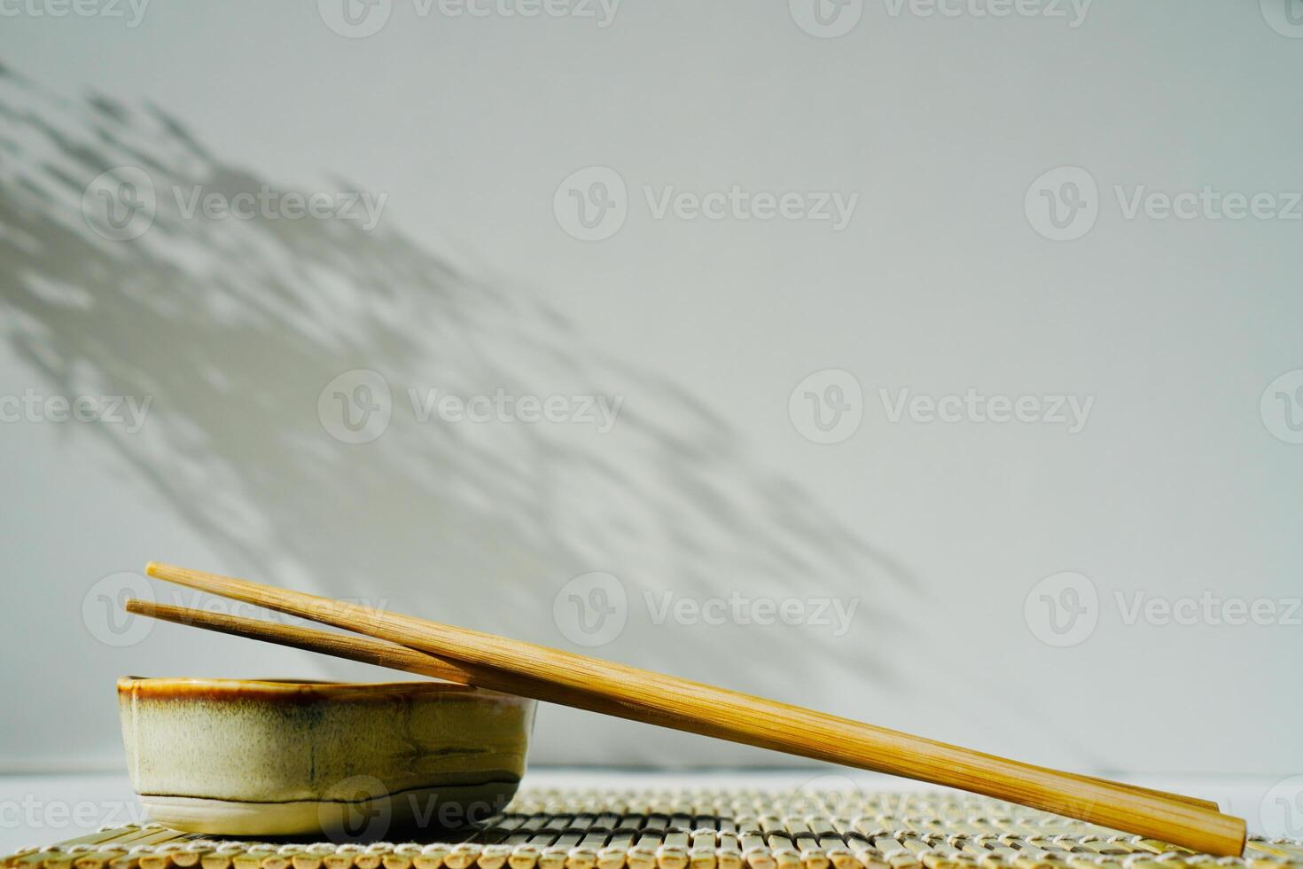 chopsticks and bowl of soy sauce photo