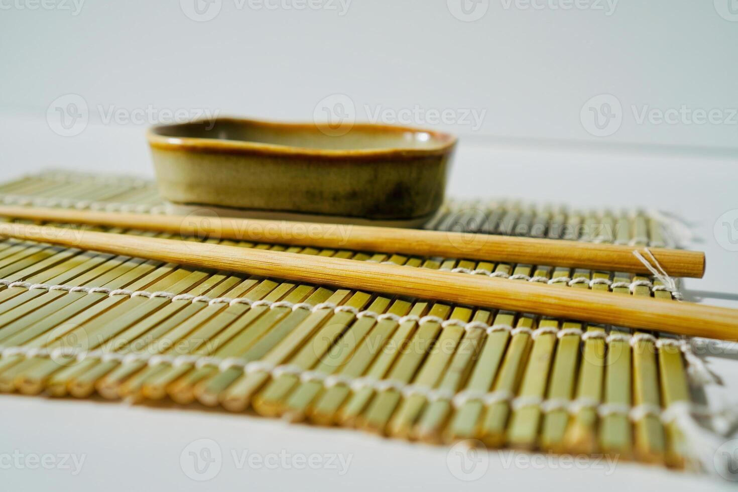 chopsticks and bowl of soy sauce photo