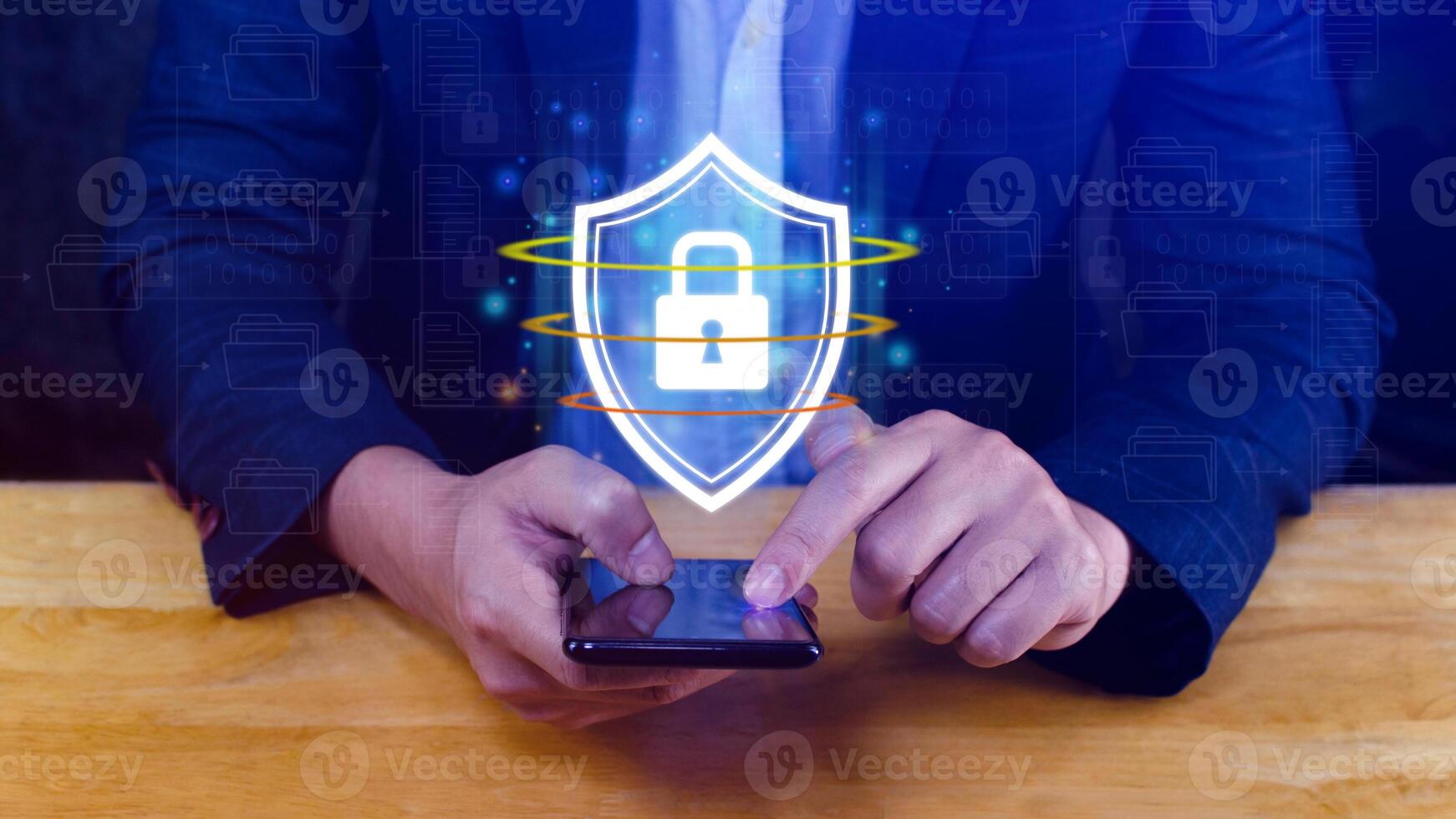 Computer network protection, secure and safe your data concept, businessman holding shield protection icon on smartphone, Security shield Lock Security Business Protect Concept. photo