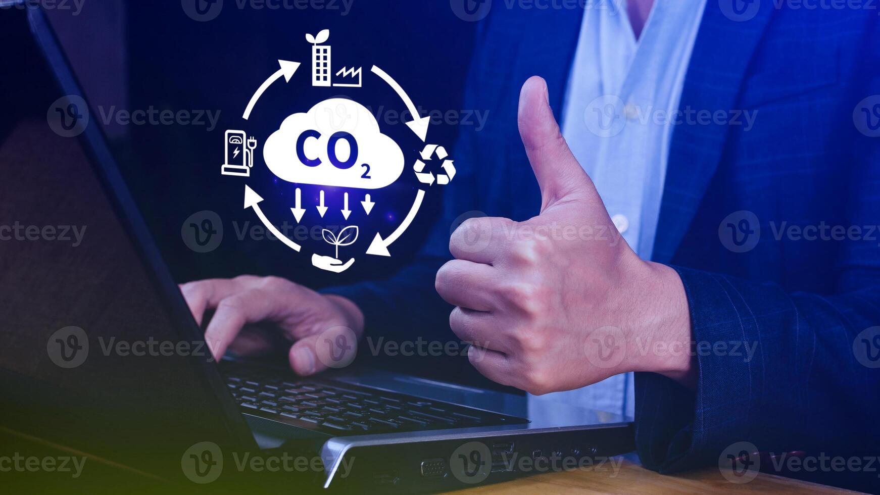 Hand holding CO2 reducing virtual icon for decrease carbon dioxide emission, carbon footprint and carbon credit to limit global warming from Bio climate change concept. photo