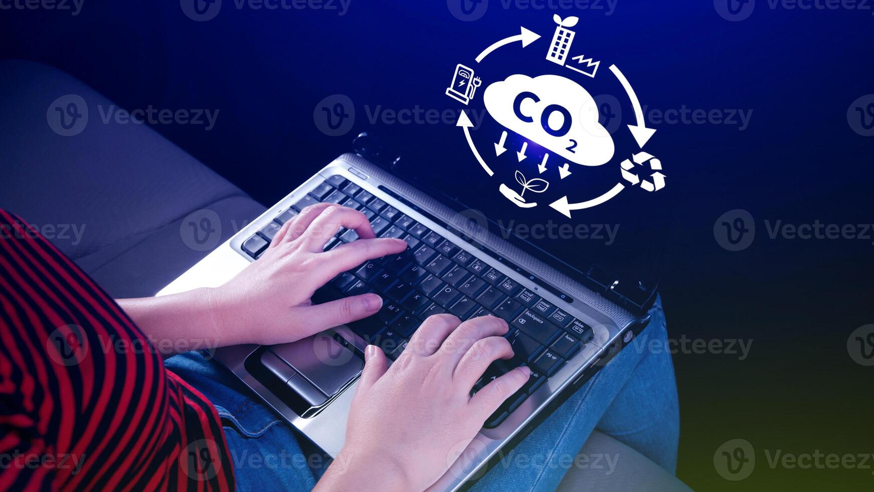 Hand holding CO2 reducing virtual icon for decrease carbon dioxide emission, carbon footprint and carbon credit to limit global warming from Bio climate change concept. photo