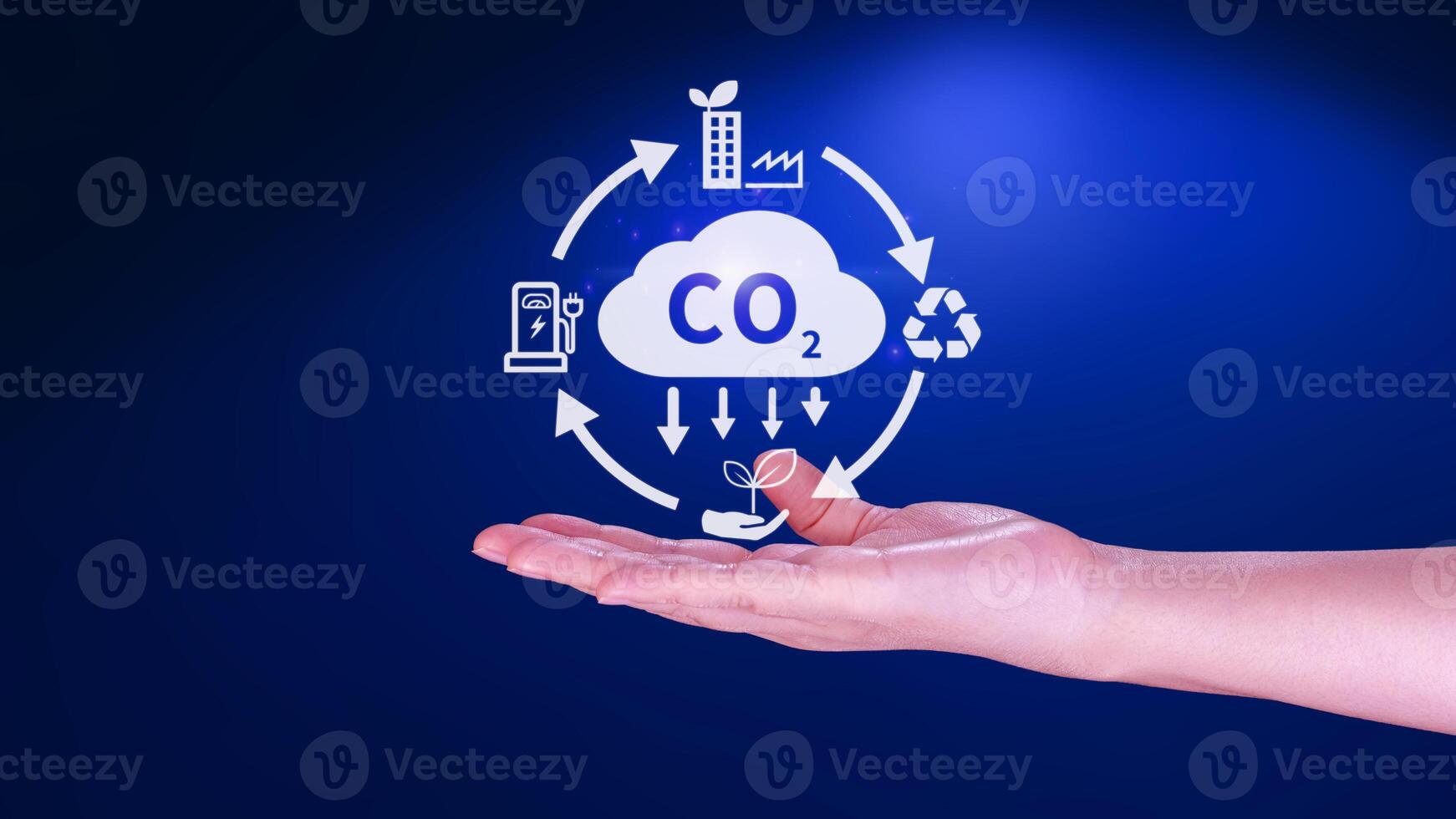 Hand holding CO2 reducing virtual icon for decrease carbon dioxide emission, carbon footprint and carbon credit to limit global warming from Bio climate change concept. photo