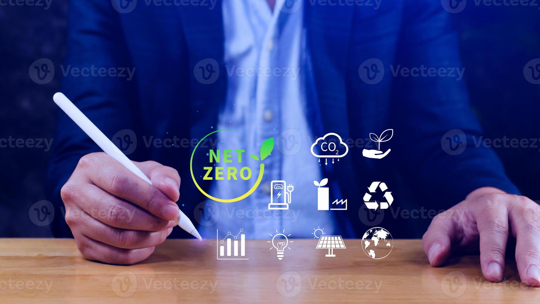 Net Zero and Carbon Neutral Concepts, Net zero greenhouse gas emissions target, Climate neutral long strategy, Businessman holding NetZero icon. photo