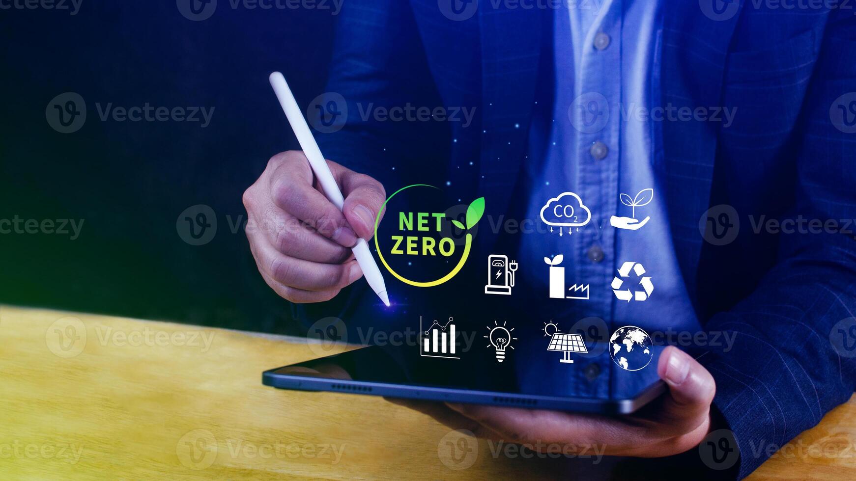 Net Zero and Carbon Neutral Concepts, Net zero greenhouse gas emissions target, Climate neutral long strategy, Businessman holding NetZero icon. photo