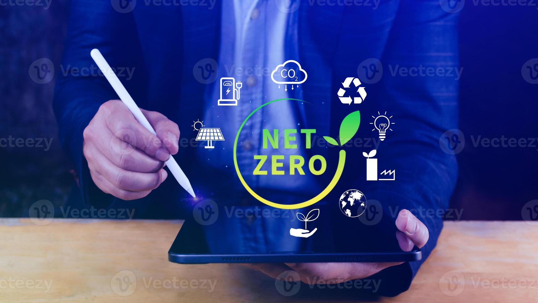 Net Zero and Carbon Neutral Concepts, Net zero greenhouse gas emissions target, Climate neutral long strategy, Businessman holding NetZero icon. photo