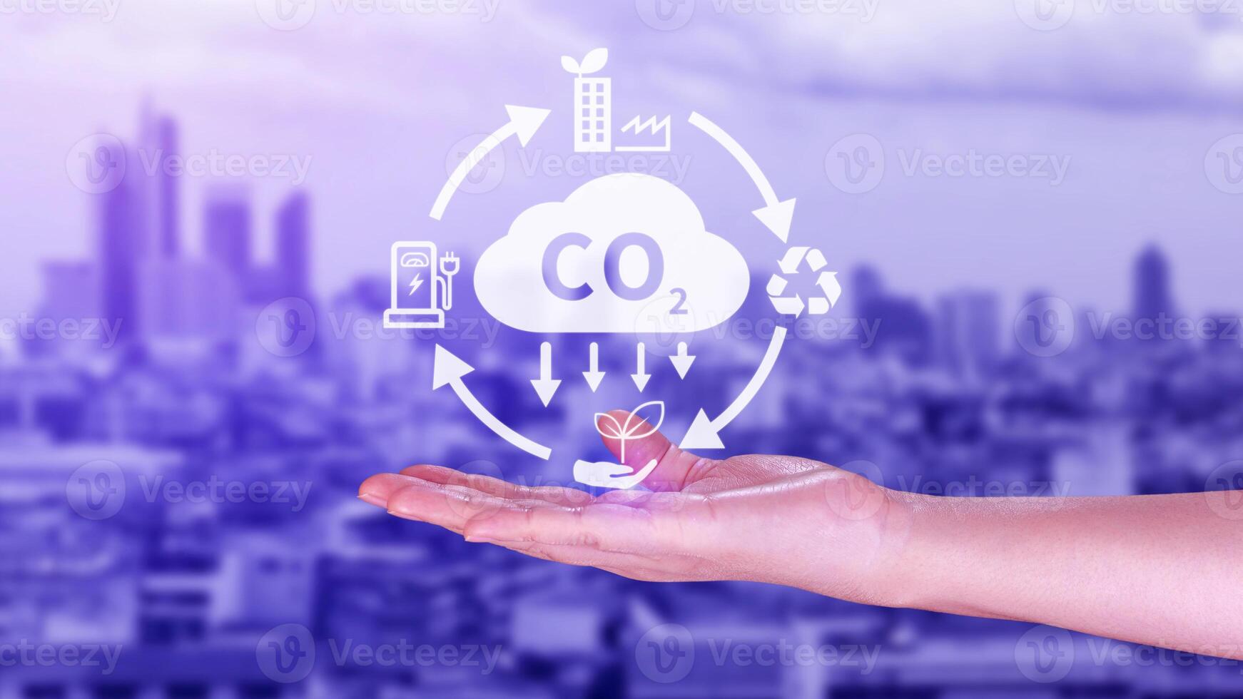 Hand holding CO2 reducing virtual icon for decrease carbon dioxide emission, carbon footprint and carbon credit to limit global warming from Bio climate change concept. photo