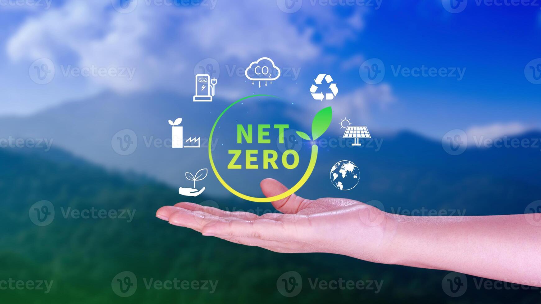 Net Zero and Carbon Neutral Concepts, Net zero greenhouse gas emissions target, Climate neutral long strategy, Businessman holding NetZero icon. photo