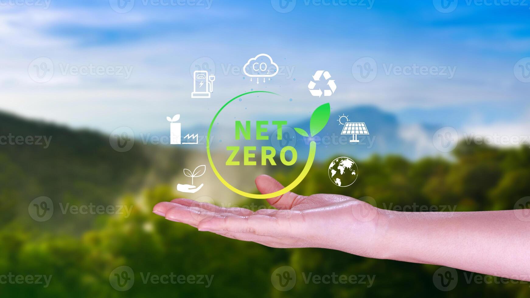 Net Zero and Carbon Neutral Concepts, Net zero greenhouse gas emissions target, Climate neutral long strategy, Businessman holding NetZero icon. photo