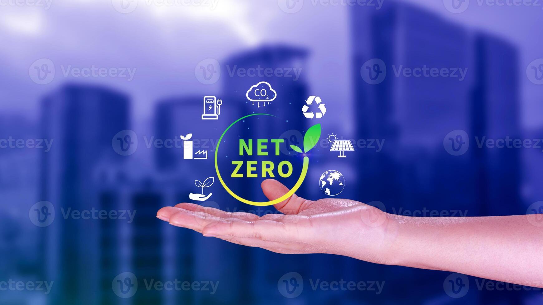 Net Zero and Carbon Neutral Concepts, Net zero greenhouse gas emissions target, Climate neutral long strategy, Businessman holding NetZero icon. photo