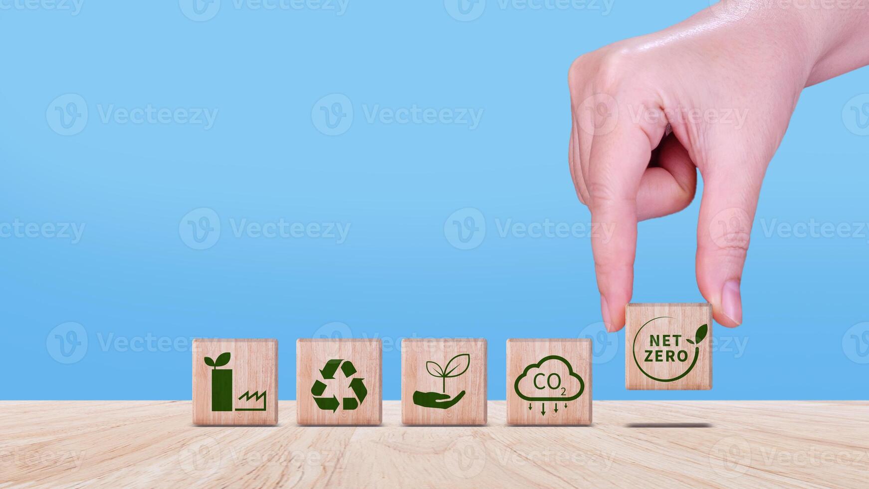 Net Zero and Carbon Neutral Concepts, Net zero greenhouse gas emissions target, Climate neutral long strategy. Wooden cubes with NetZero icon. photo