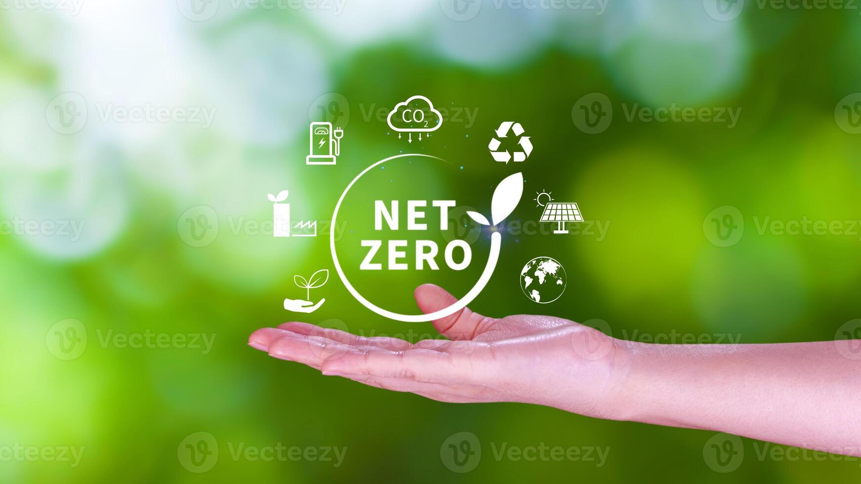 Net Zero and Carbon Neutral Concepts, Net zero greenhouse gas emissions target, Climate neutral long strategy, Businessman holding NetZero icon. photo