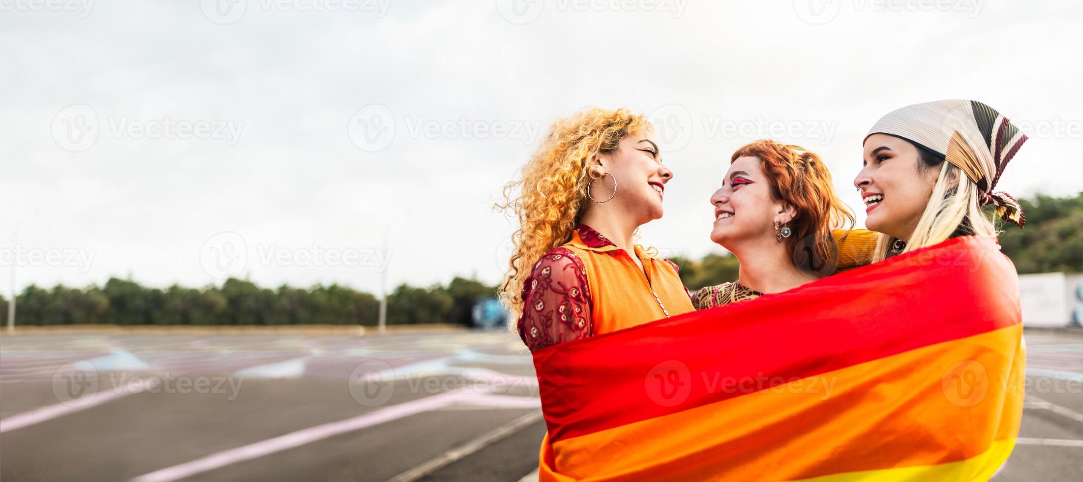 Happy young girls celebrating gay pride festival - LGBT community concept photo