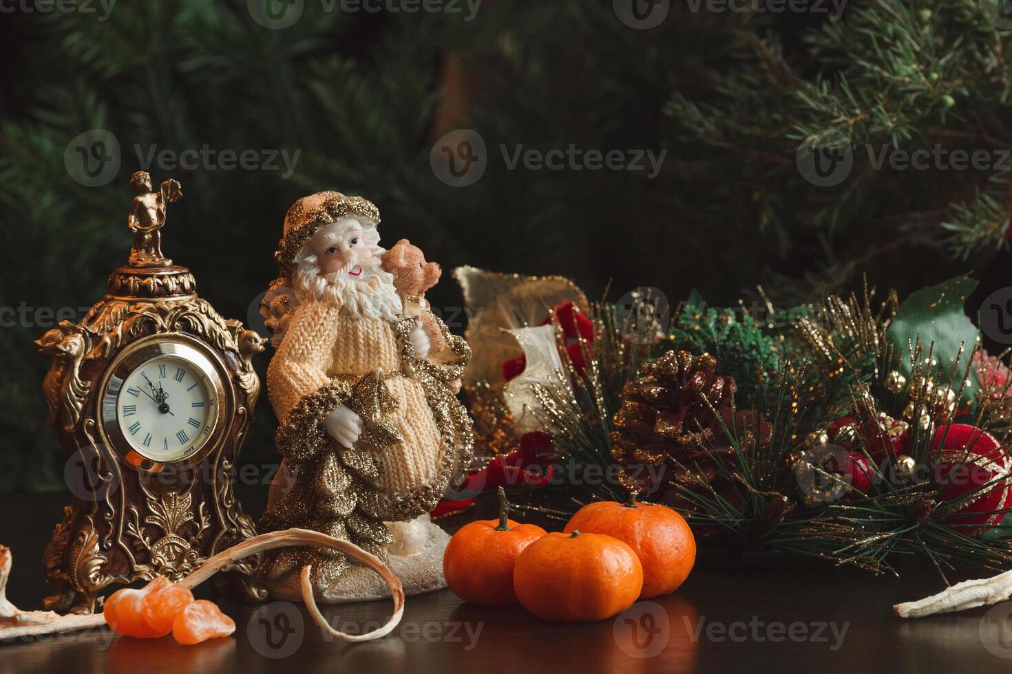 Christmas card. New year. Composition clock, tangerines, Santa on the background of fir branches photo