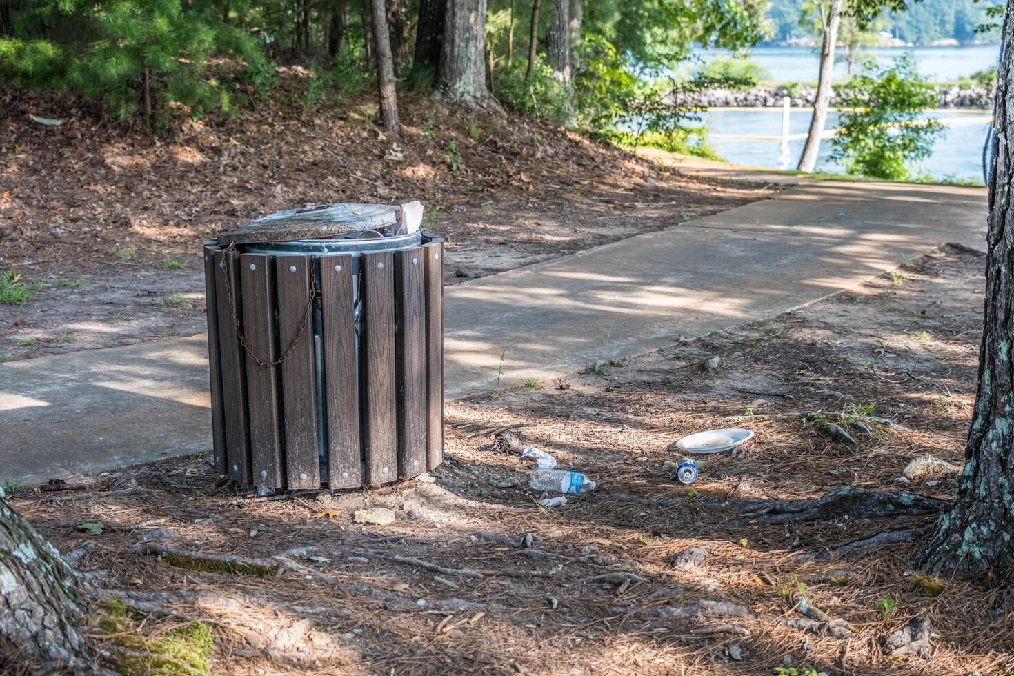 Garbage can overflow in the park photo