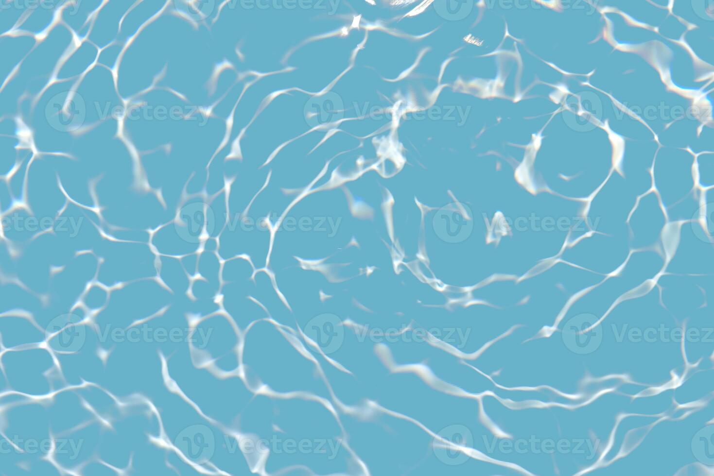 Bluewater waves on the surface ripples blurred. Defocus blurred transparent blue colored clear calm water surface texture with splash and bubbles. Water waves with shining pattern texture background. photo