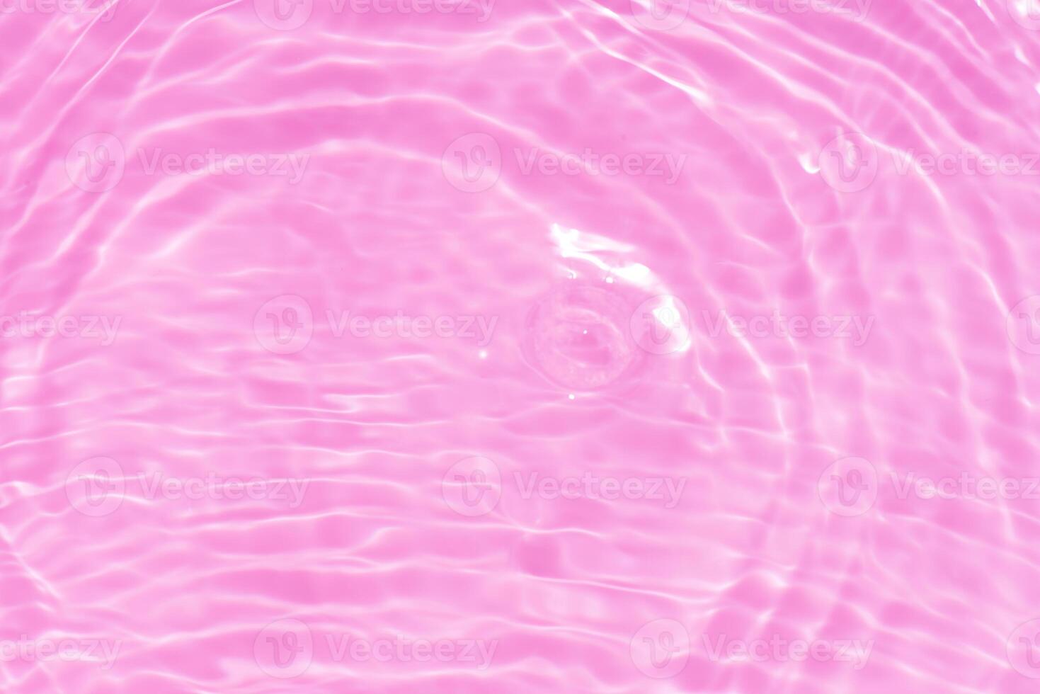 Bluewater waves on the surface ripples blurred. Defocus blurred transparent blue colored clear calm water surface texture with splash and bubbles. Water waves with shining pattern texture background. photo