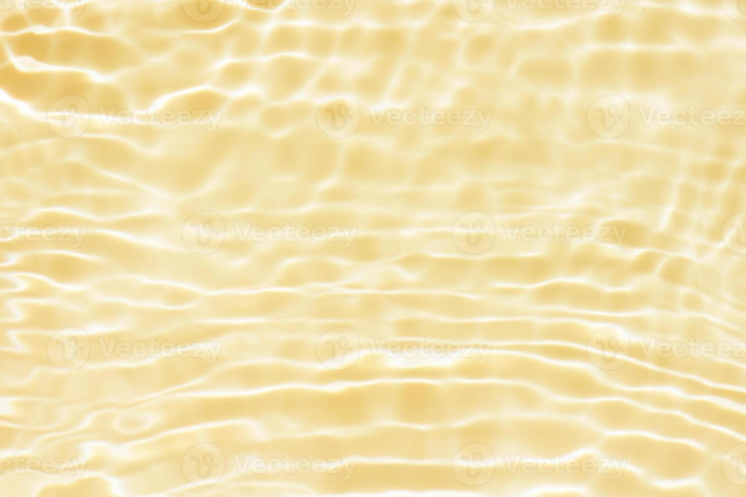 Bluewater waves on the surface ripples blurred. Defocus blurred transparent blue colored clear calm water surface texture with splash and bubbles. Water waves with shining pattern texture background. photo