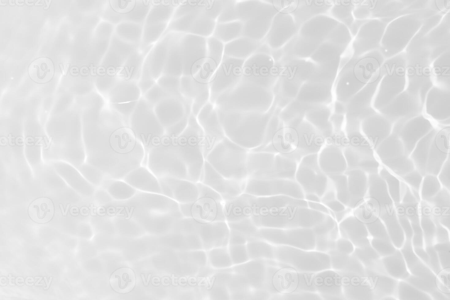 Bluewater waves on the surface ripples blurred. Defocus blurred transparent blue colored clear calm water surface texture with splash and bubbles. Water waves with shining pattern texture background. photo