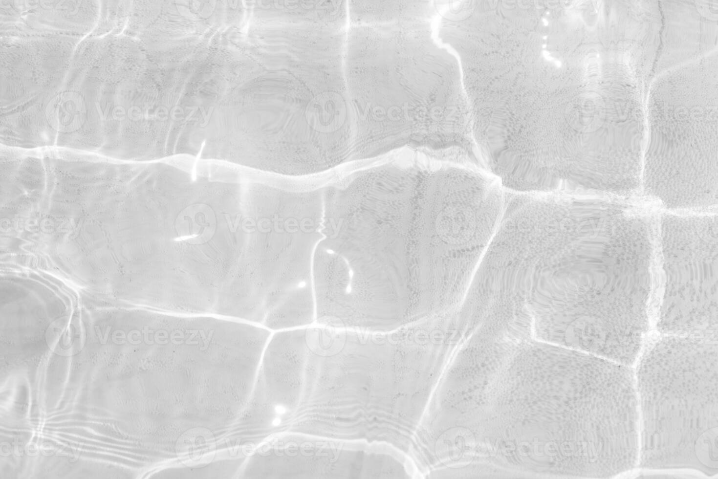 Bluewater waves on the surface ripples blurred. Defocus blurred transparent blue colored clear calm water surface texture with splash and bubbles. Water waves with shining pattern texture background. photo