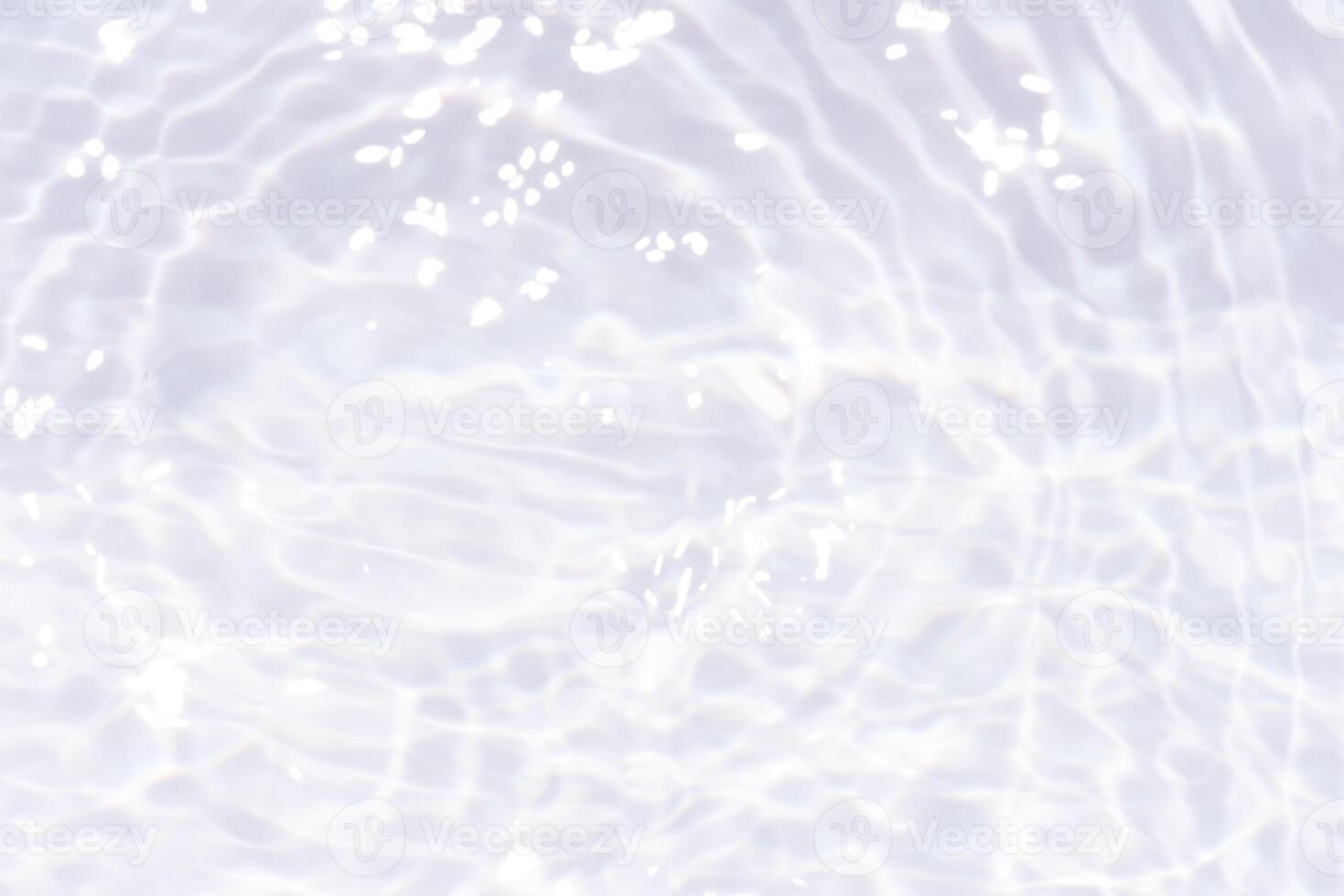 Bluewater waves on the surface ripples blurred. Defocus blurred transparent blue colored clear calm water surface texture with splash and bubbles. Water waves with shining pattern texture background. photo