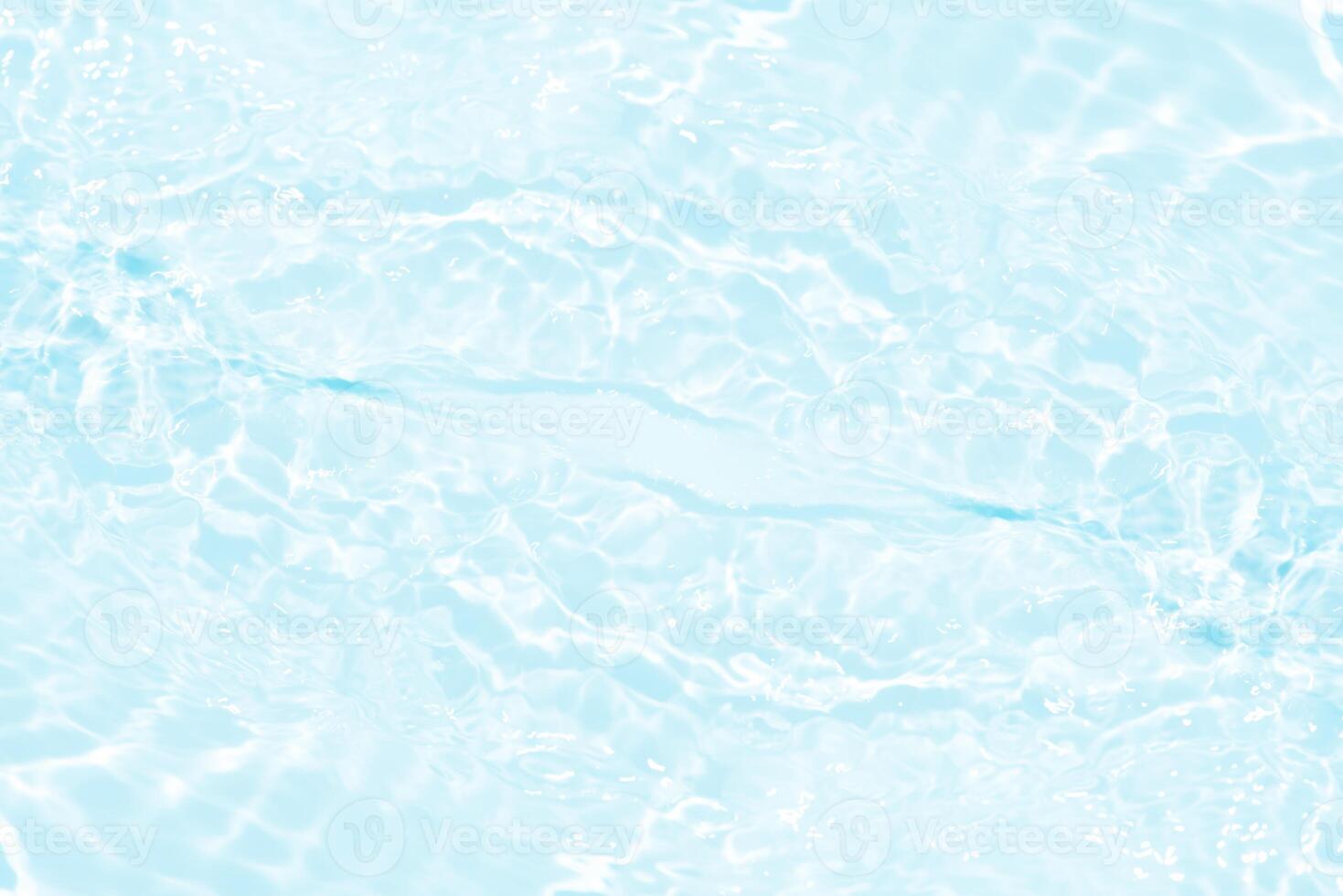 Bluewater waves on the surface ripples blurred. Defocus blurred transparent blue colored clear calm water surface texture with splash and bubbles. Water waves with shining pattern texture background. photo