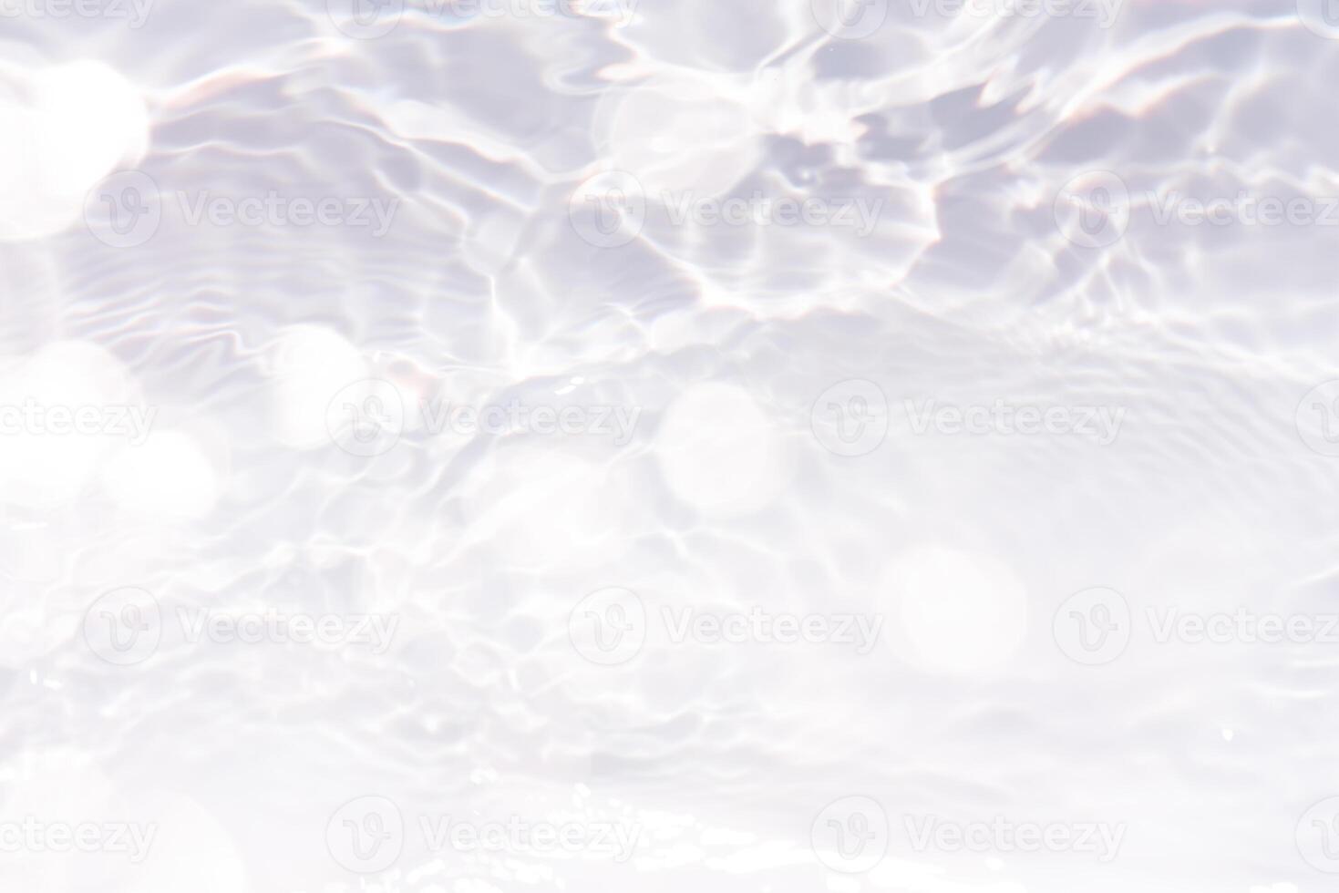 Bluewater waves on the surface ripples blurred. Defocus blurred transparent blue colored clear calm water surface texture with splash and bubbles. Water waves with shining pattern texture background. photo