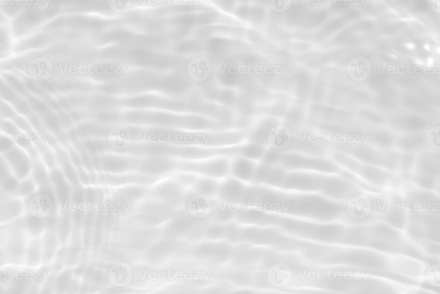 Bluewater waves on the surface ripples blurred. Defocus blurred transparent blue colored clear calm water surface texture with splash and bubbles. Water waves with shining pattern texture background. photo