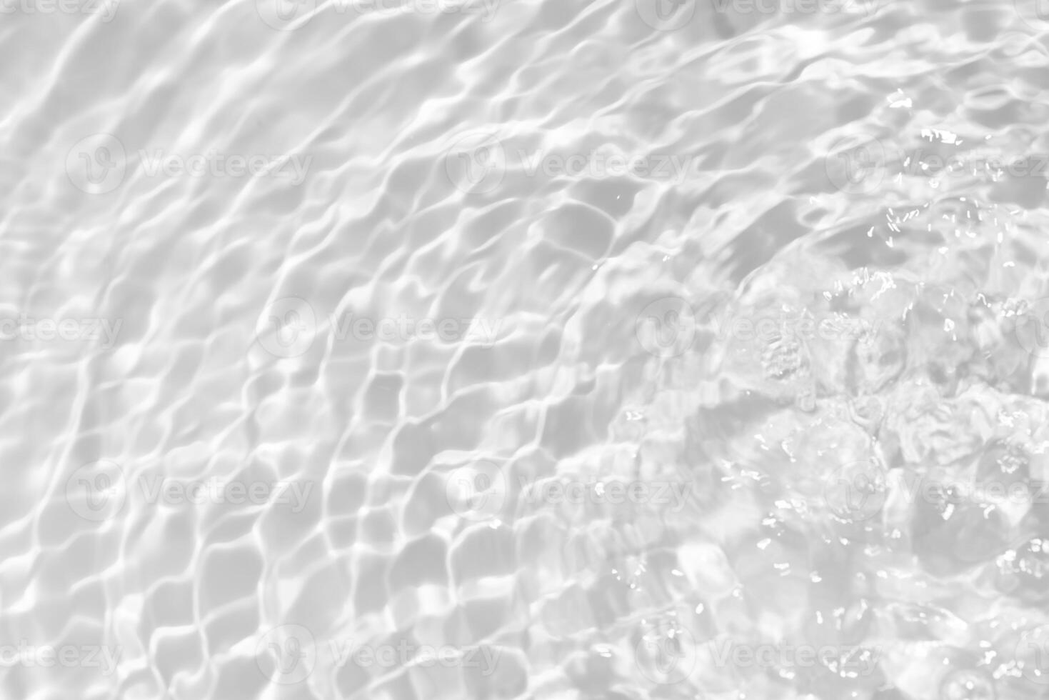 Bluewater waves on the surface ripples blurred. Defocus blurred transparent blue colored clear calm water surface texture with splash and bubbles. Water waves with shining pattern texture background. photo