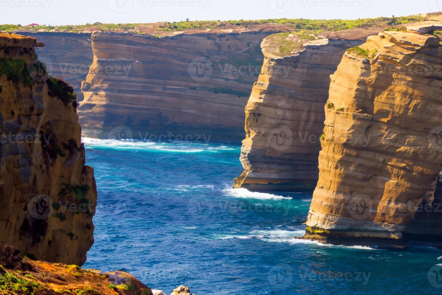 Seaside Majesty Breathtaking Coastal Cliffs Meet Stunning Blue Sea, A Spectacle of Nature's Grandeur photo