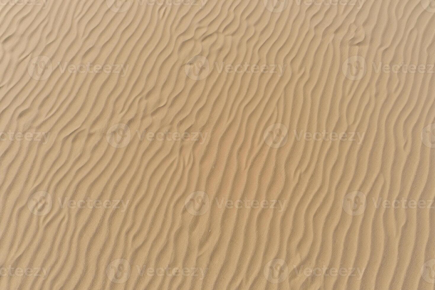 Horizon Haven Aerial Serenity Captures Beautiful Beach Sand from Above, a Tranquil Tapestry of Coastal Beauty photo