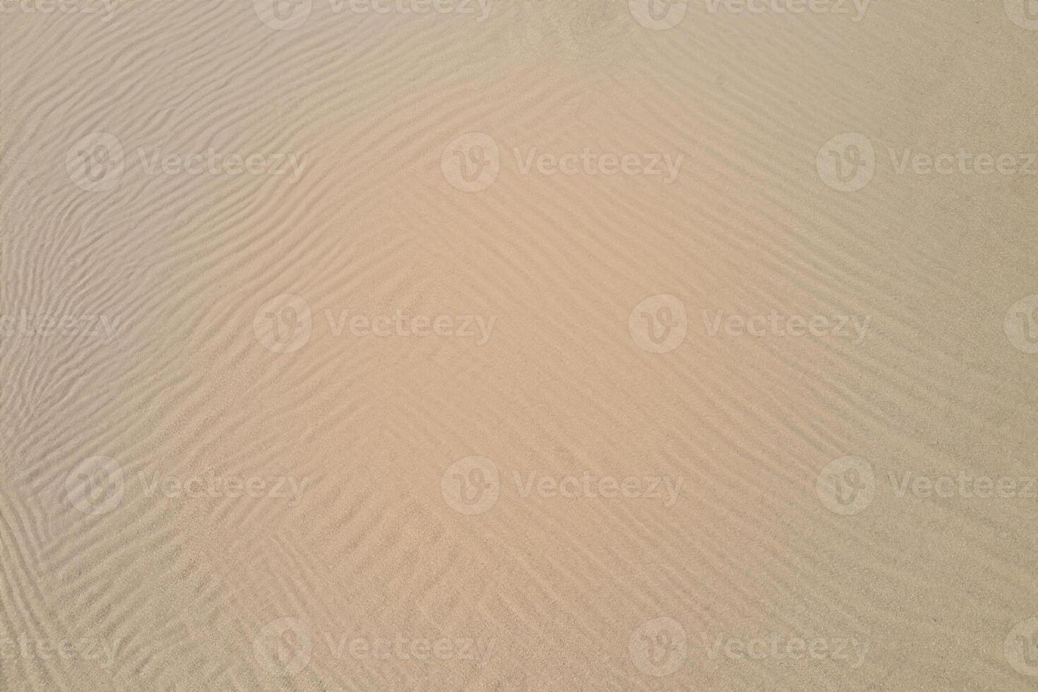 Horizon Haven Aerial Serenity Captures Beautiful Beach Sand from Above, a Tranquil Tapestry of Coastal Beauty photo