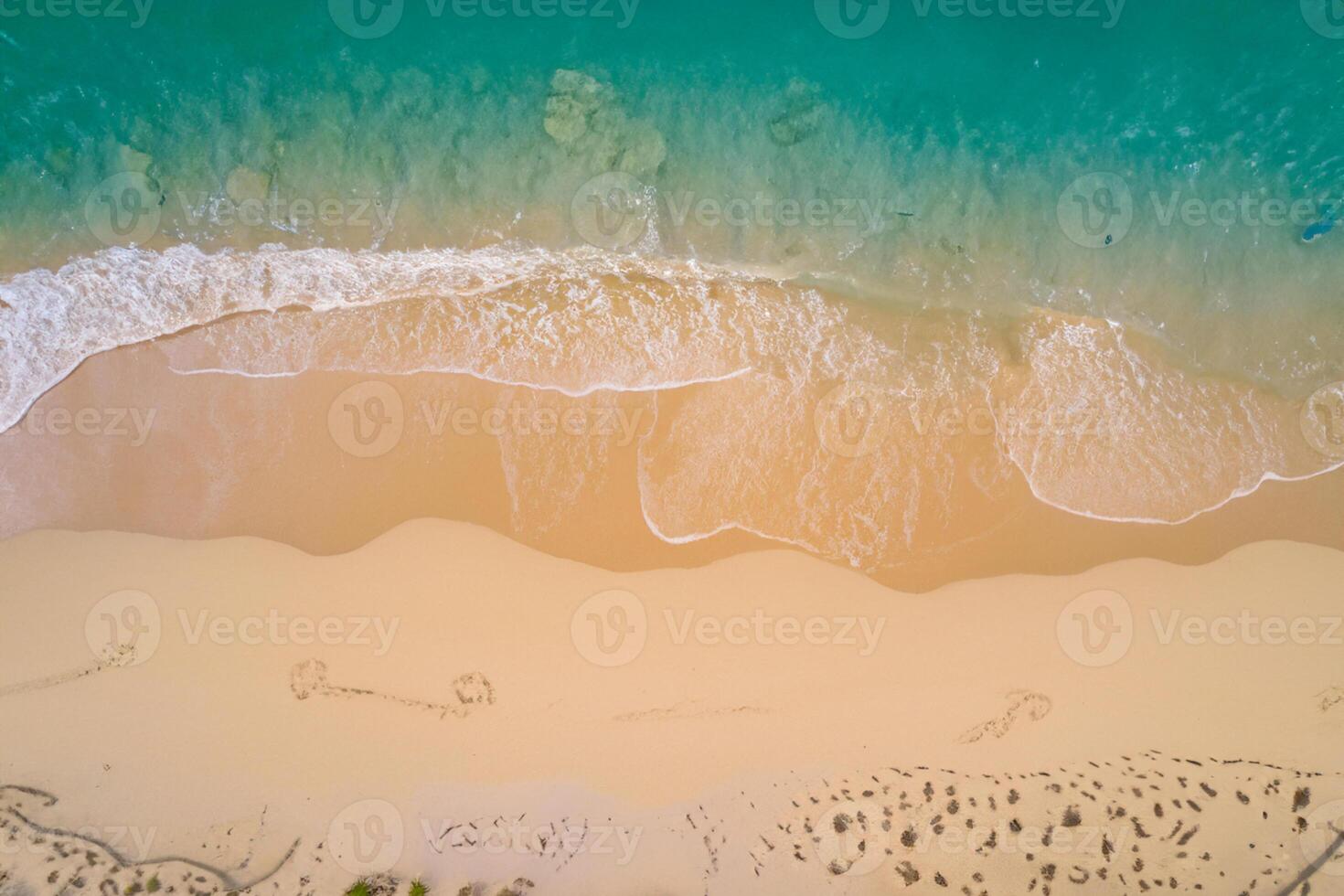 Horizon Haven Aerial Serenity Captures Beautiful Beach Sand from Above, a Tranquil Tapestry of Coastal Beauty photo