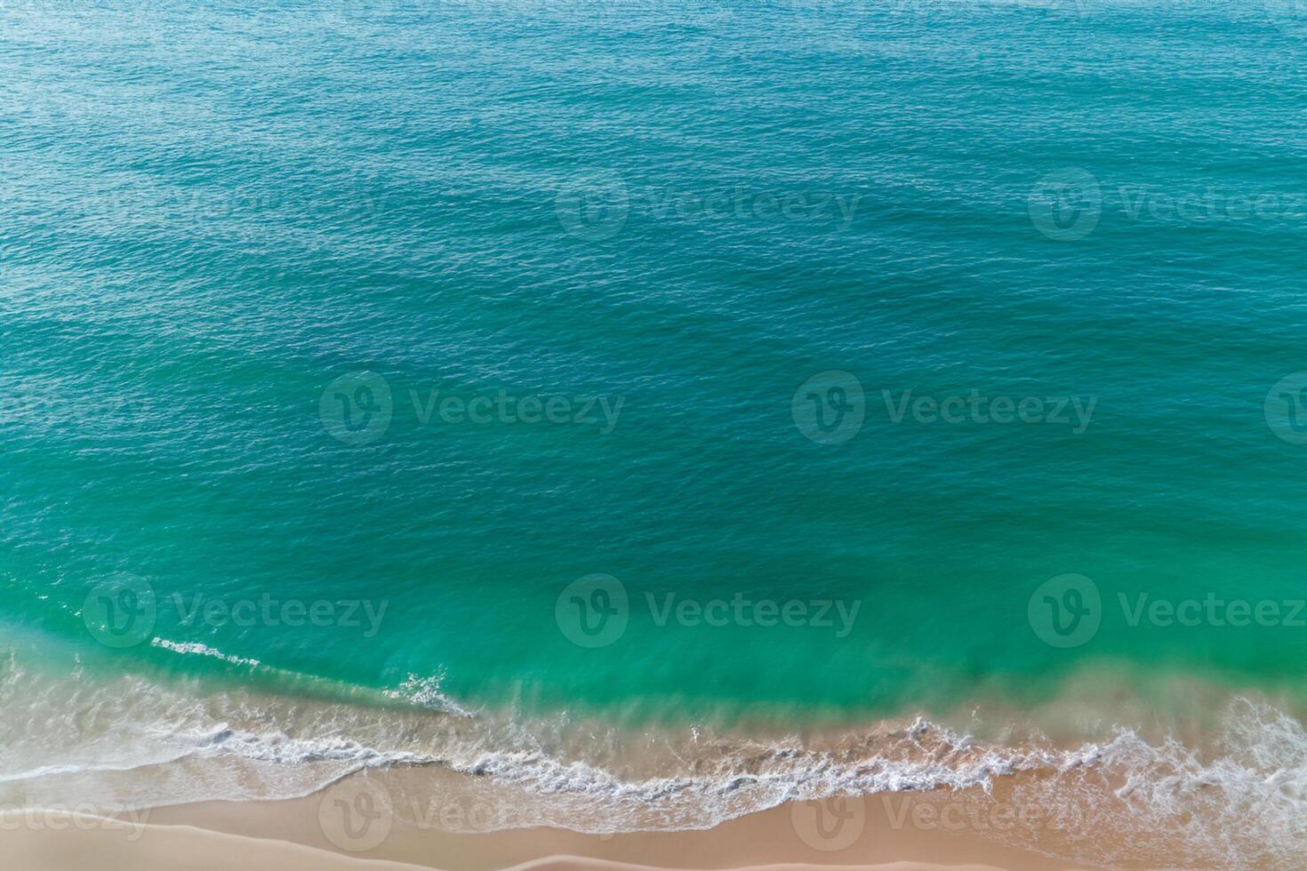 Horizon Haven Aerial Serenity Captures Beautiful Beach Sand from Above, a Tranquil Tapestry of Coastal Beauty photo