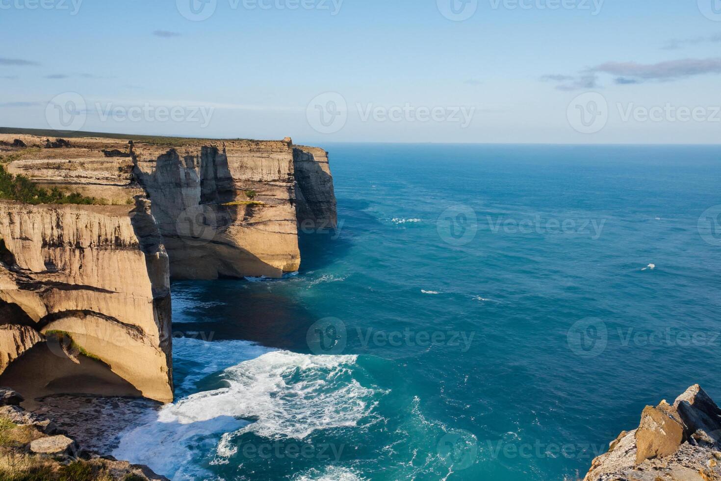 Seaside Majesty Breathtaking Coastal Cliffs Meet Stunning Blue Sea, A Spectacle of Nature's Grandeur photo