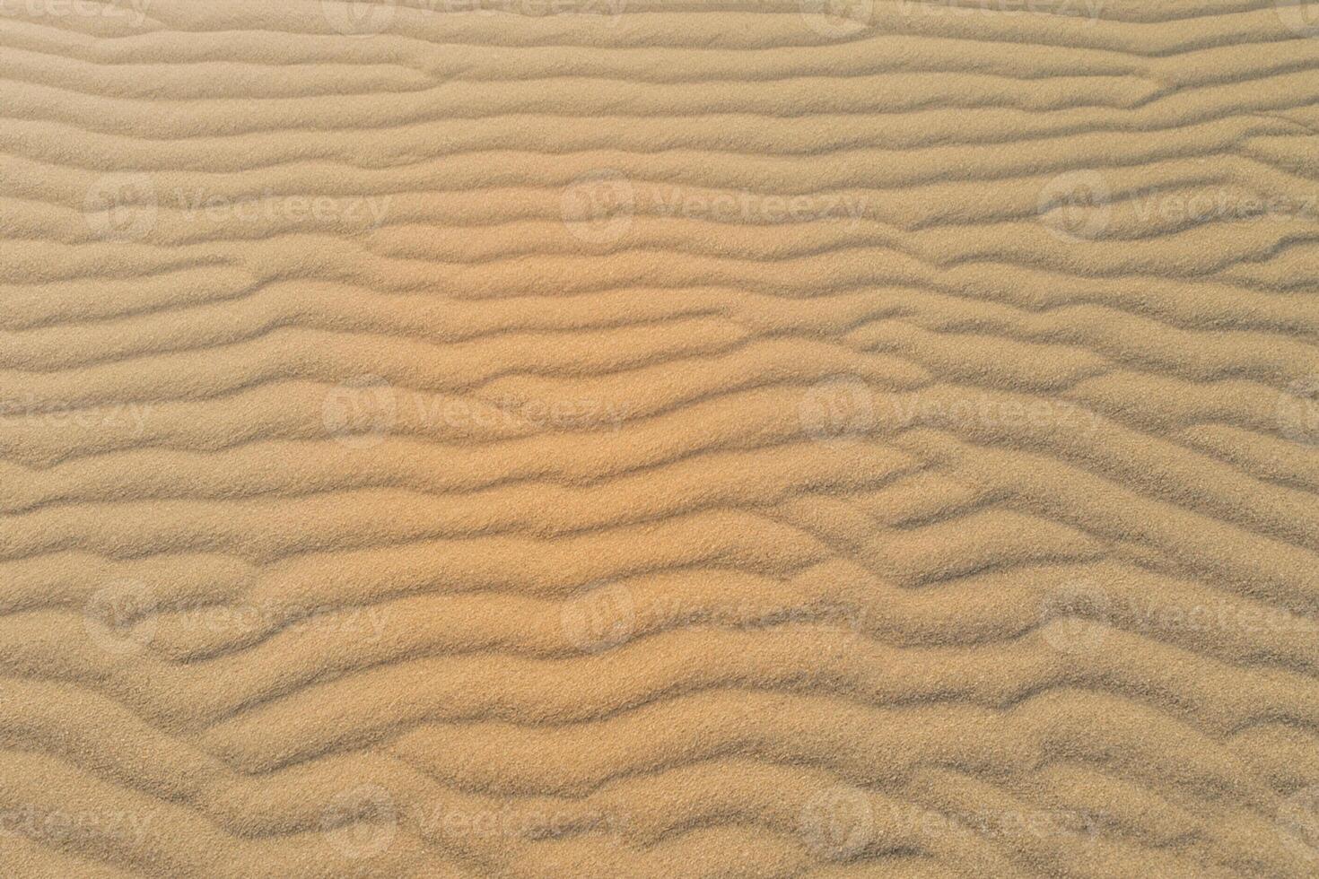 Horizon Haven Aerial Serenity Captures Beautiful Beach Sand from Above, a Tranquil Tapestry of Coastal Beauty photo