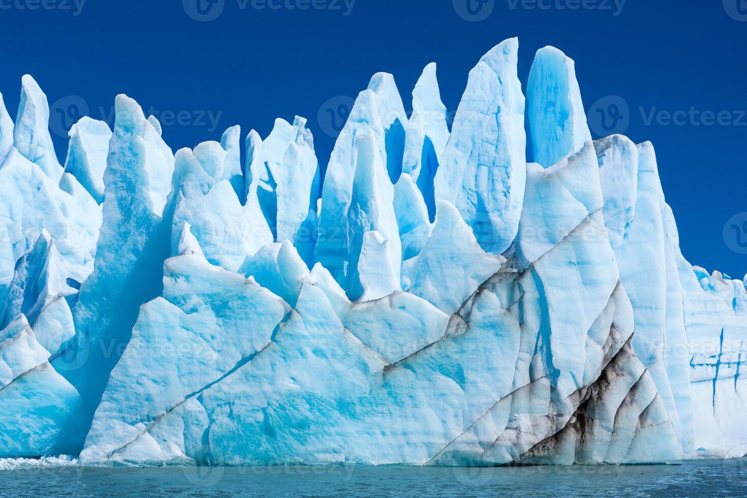 Majestic Ice Cliffs Crowned by a Cool Atmosphere, Framed by the Beautiful Sea and Sky, Conjuring a Harmonious Panorama of Nature's Icy Grandeur and Oceanic Splendor photo